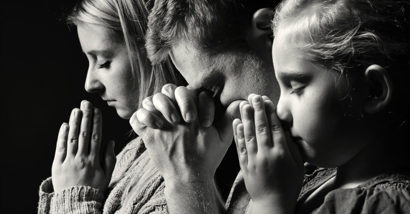 family praying